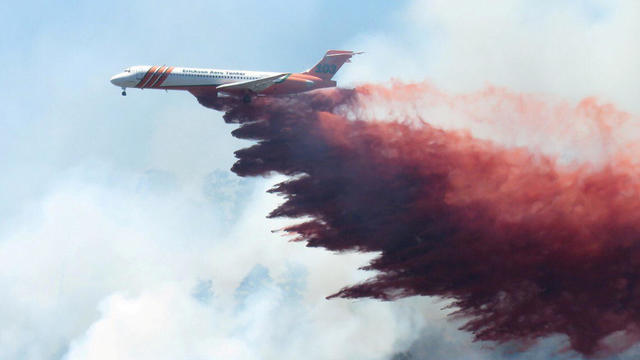 Plane drops fire-retardant chemicals on the 416 Fire near Durango, Colorado 