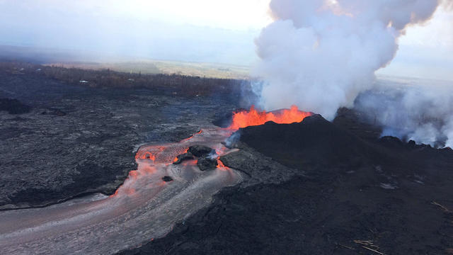 Lava fragments falling from lava fountains at fissure 8 are building a cinder-and-spatter cone around the erupting vent during ongoing eruptions of the Kilauea Volcano in Hawaii 