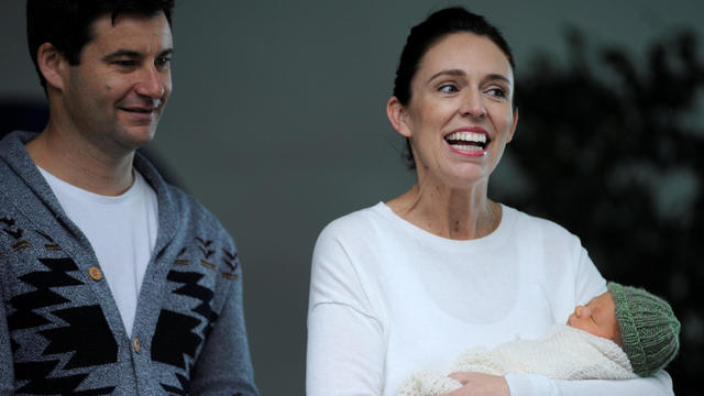 New Zealand Prime Minister Jacinda Ardern carries her newborn baby as she walks out of the Auckland Hospital in New Zealand 