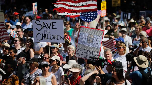 Signs from protests in cities across U.S. over immigration policy 