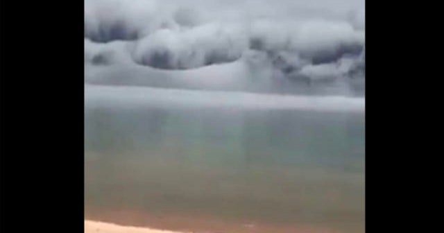 Wave-like shelf cloud caught on camera rolling over lake in Michigan ...