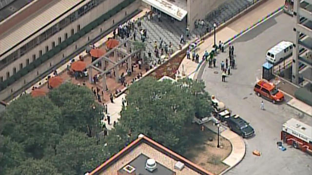 A screen capture of aerial footage shows people outside the Johns Hopkins Medicine campus in Baltimore after the possible release of tuberculosis in an internal bridge between two buildings on July 5, 2018. 