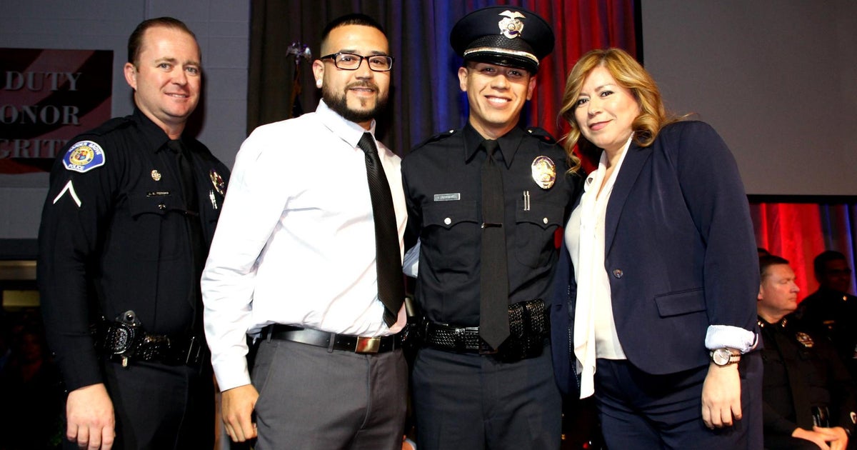 Police officer becomes unlikely father figure for young man - CBS News