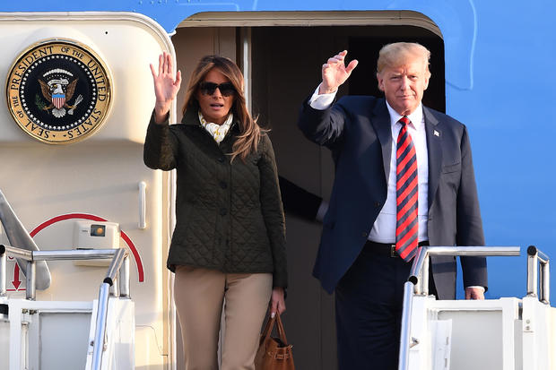President Trump and first lady Melania Trump wave as they disembark Air Force One at Prestwick Airport, south of Glasgow, Scotland, on July 13, 2018, on the second day of the Trumps' U.K. visit. 