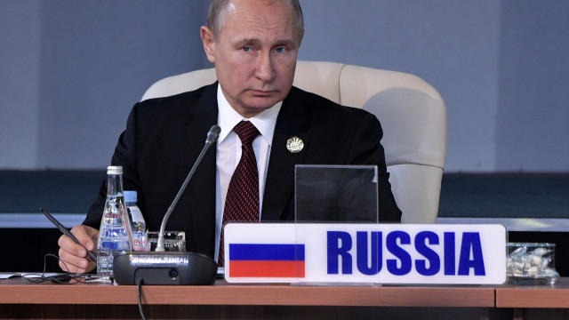 Russian President Putin attends a session of the BRICS summit in Johannesburg 