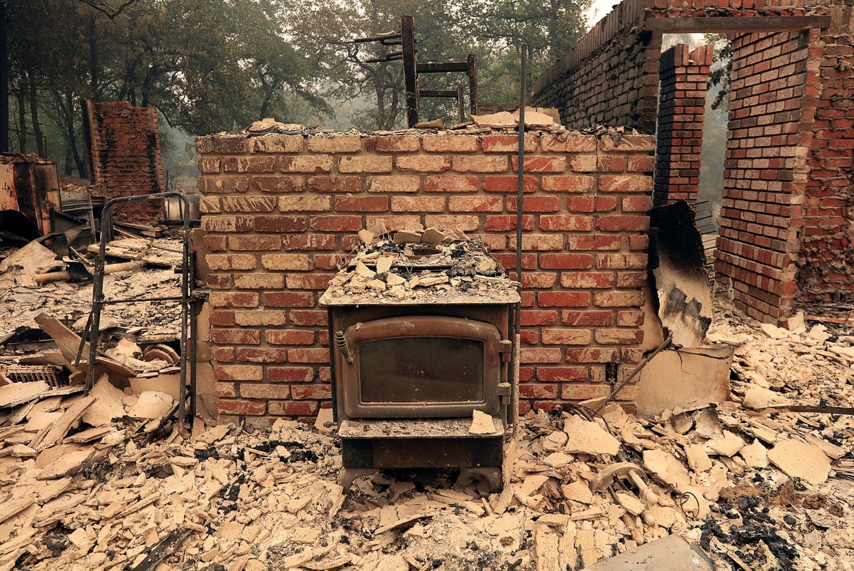 The debris of a burned home is seen after the Carr Fire west of Redding 