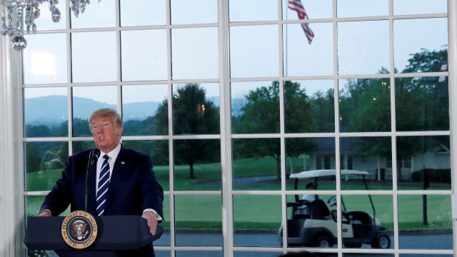 U.S. President Donald Trump speaks at a dinner with business leaders at Trump National Golf Club in Bedminster 