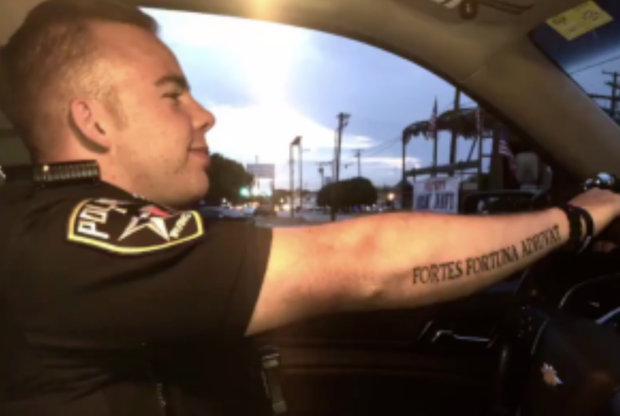 Irving Police officer with tattoo 