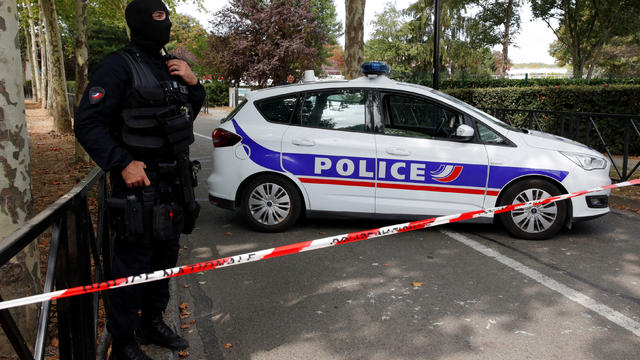 French police secure a street after a man killed two persons and injured an other in a knife attack in Trappes, near Paris 