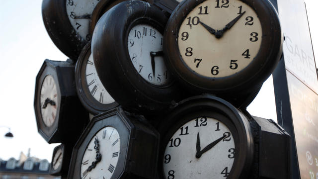 FILE PHOTO: A giant sculpture constructed with the faces of clocks is seen outside a Paris train station 