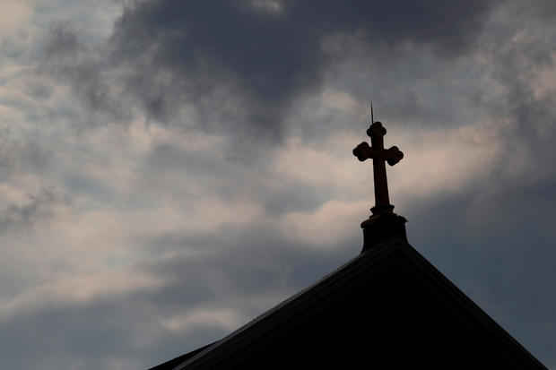 FILE PHOTO: Storm clouds pass over a Roman Catholic church in Pittsburgh 