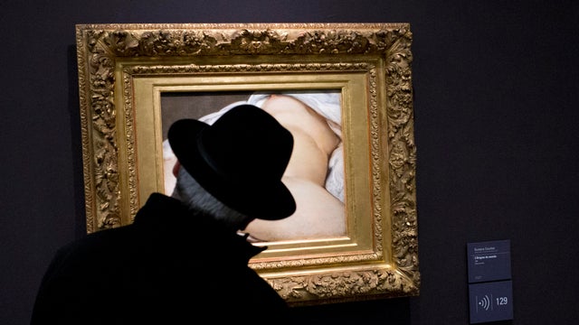 A visitor looks at Gustave Courbet's 1866 "The Origin of the World" painting, which depicts female genitalia, at the Mus&eacute;e d'Orsay in Paris Feb. 12, 2016. 