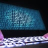 Hacker with laptop computer 