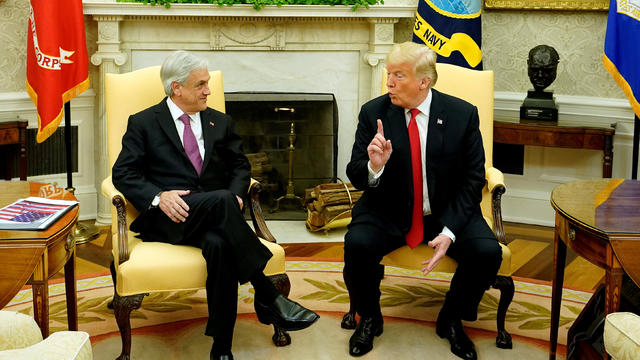 U.S. President Donald Trump speaks with Chilean President Sebastian Pinera in the Oval Office of the White House in Washington 