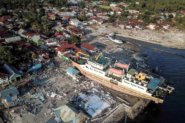 A ship is seen stranded on the shore after an earthquake and tsunami hit the area in Wani 