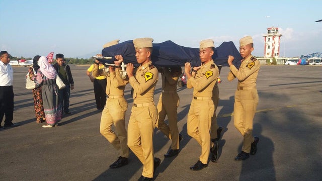 Social media picture of the body of air traffic controller and earthquake victim Anthonius Gunawan Agung being carried to a helicopter during his funeral procession in Makassar 