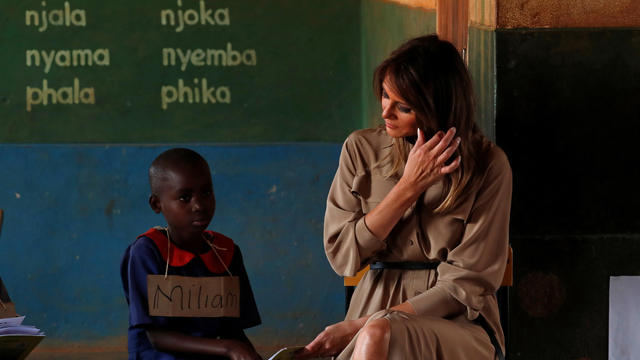 U.S. first lady Melania Trump looks on as she visits a school in Lilongwe 