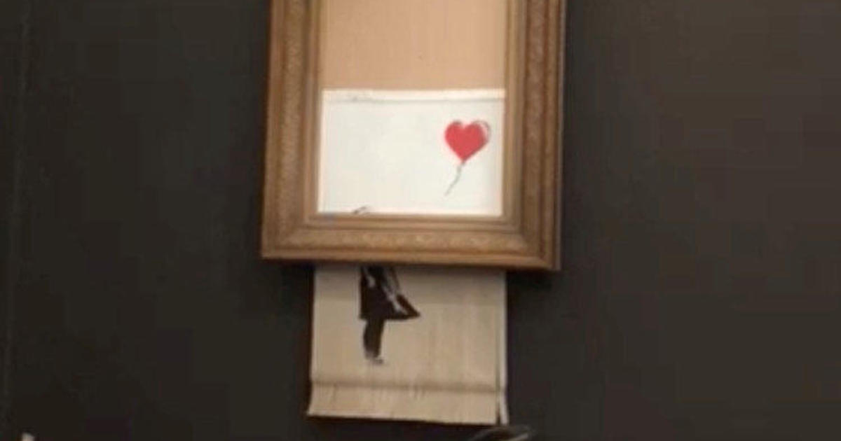 Onhandig zwaan touw Banksy painting – Girl with Balloon – self-descructs through built-in  shredded after artwork sale at Sotheby's - CBS News