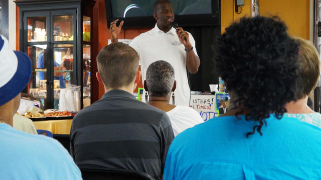 Candidate Andrew Gillum who is seeking the Democratic nomination for Florida governor, speaks to voters on a tour of barbershops in Sarasota 