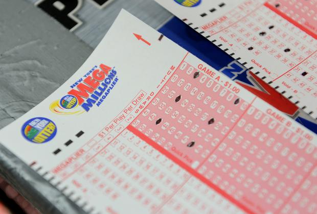 Mega Millions lottery ticket forms at a 