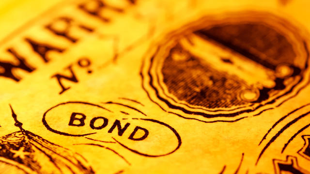 A close-up of the word bond with a yellow tint 