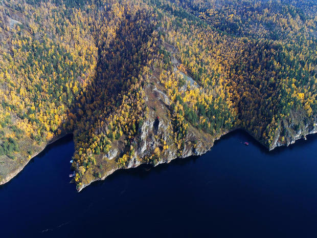 An aerial view shows the autumn foliage on the banks of the Yenisei River in the Siberian taiga outside Krasnoyarsk 
