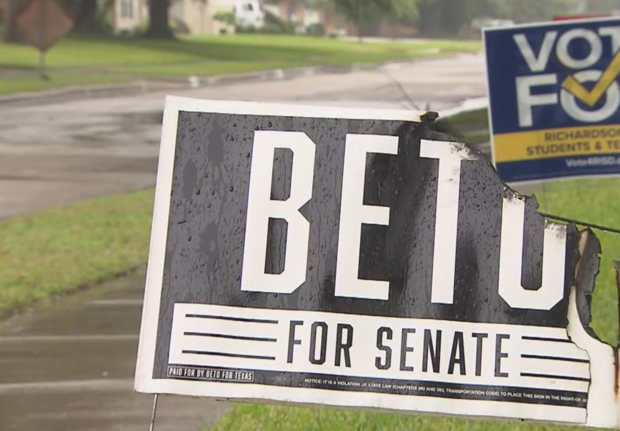 partially burned Beto O'Rourke campaign yard sign 