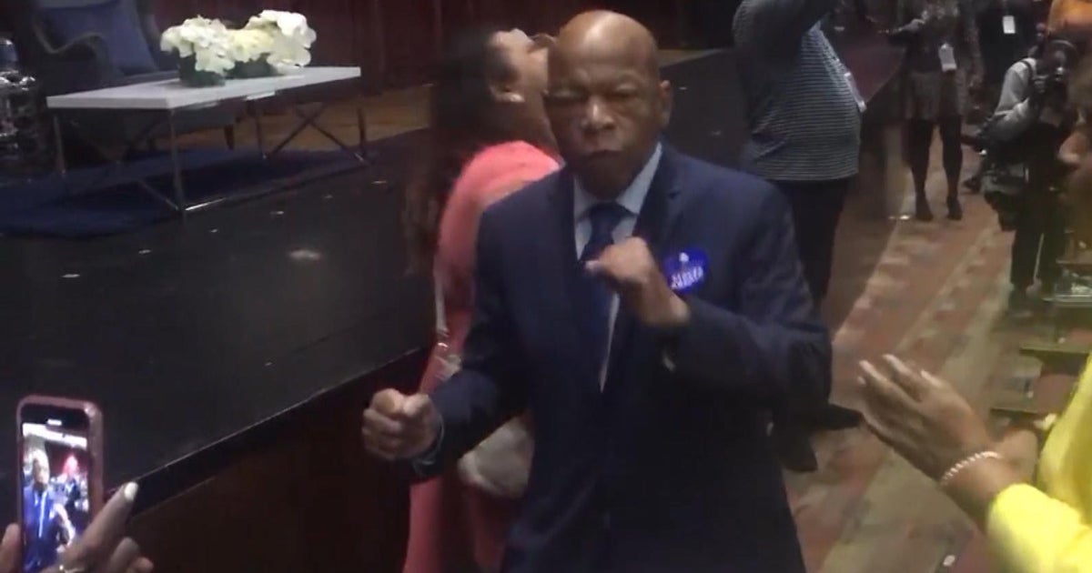 Rep. John Lewis gets "Happy" at an event for Stacey Abrams CBS News