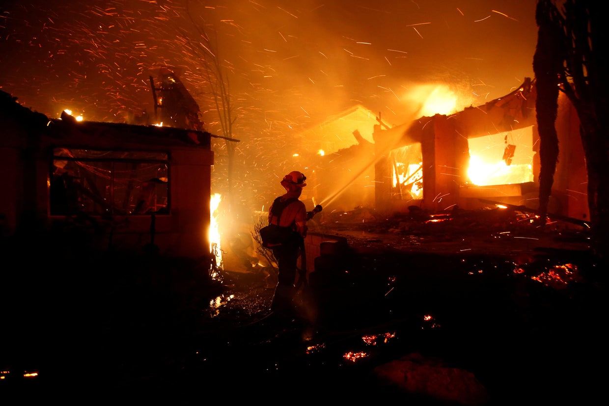 Firefighters battle flames overnight during a wildfire that burned dozens of homes in Thousand Oaks 