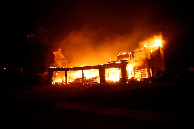 A home burns during a wildfire that claimed dozens of homes in Thousand Oaks 