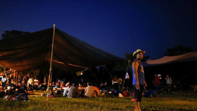 Migrants, part of a caravan traveling en route to the United States, rest in a sport complex that is currently used as a temporary shelter, in Matias Romero Avendano 