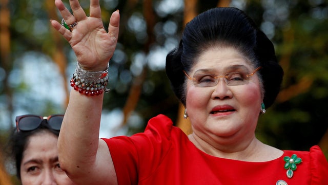 FILE PHOTO: Philippines Former First Lady and Congresswoman Imelda Marcos waves to supporters as she takes part in the announcement of her son BongBong Marcos' vice-presidential candidacy, in Manila 