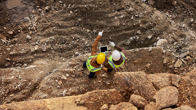 Construction Workers Inspecting Site 