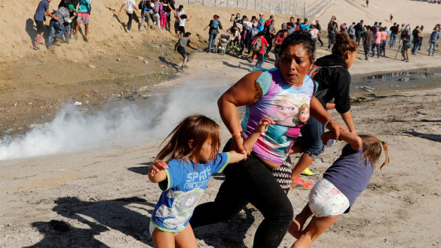 migrant caravan — tear gas at U.S.-Mexico border 