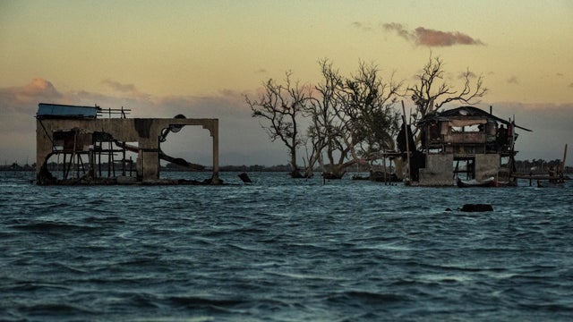 Filipinos Face Rising Sea Levels At Bulacan's Sinking Village 