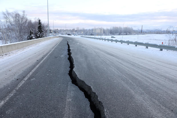 A crack which opened up along a roadway near the airport is seen after an earthquake in Anchorage 