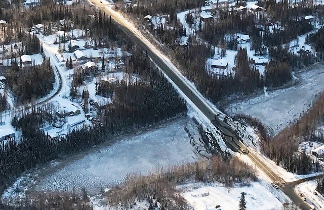 A damaged road is seen during a survey by the Alaska National Guard 176th Wing after an earthquake near Anchorage