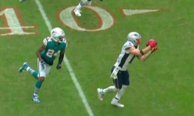 FILE - In this Sunday, Dec. 9, 2018 file photo, New England Patriots strong  safety Duron Harmon (21) tackles Miami Dolphins running back Frank Gore  (21), during the first half of an