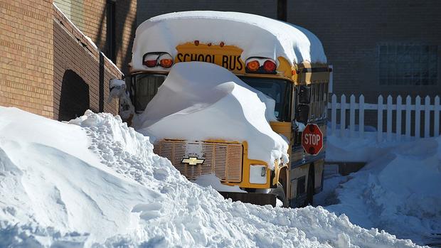 A school bus is seen under a thick layer 
