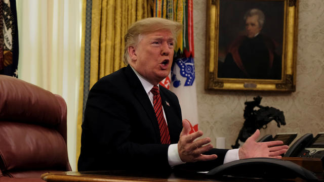 U.S. President Donald Trump speaks with reporters after holding a video call with U.S. military service members in the Oval Office on Christmas morning in Washington 