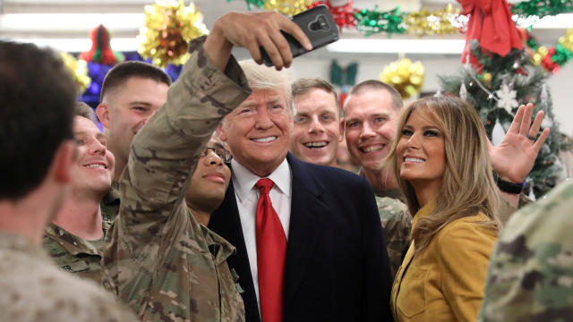 U.S. President Trump and the First Lady greet military personnel at the dining facility during an unannounced visit to Al Asad Air Base, Iraq 