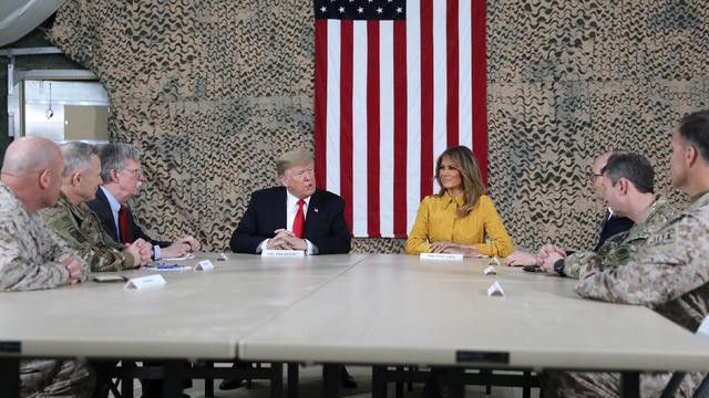 U.S. President Trump meets political and military leaders during an unannounced visit to Al Asad Air Base 