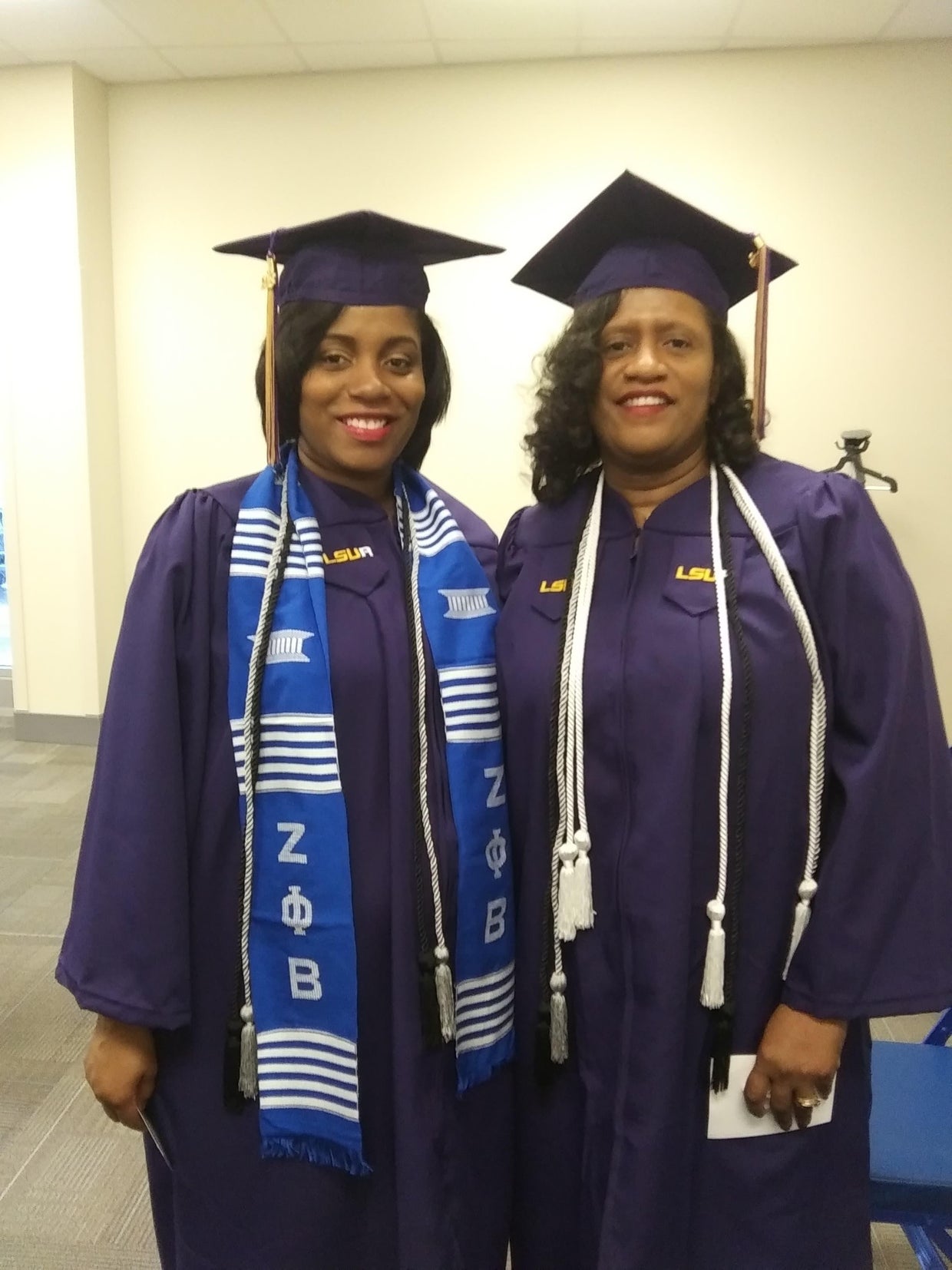 Mom in labor walks across graduation stage to receive college diploma