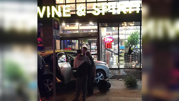 minneapolis police car hits car into hums liquor store 