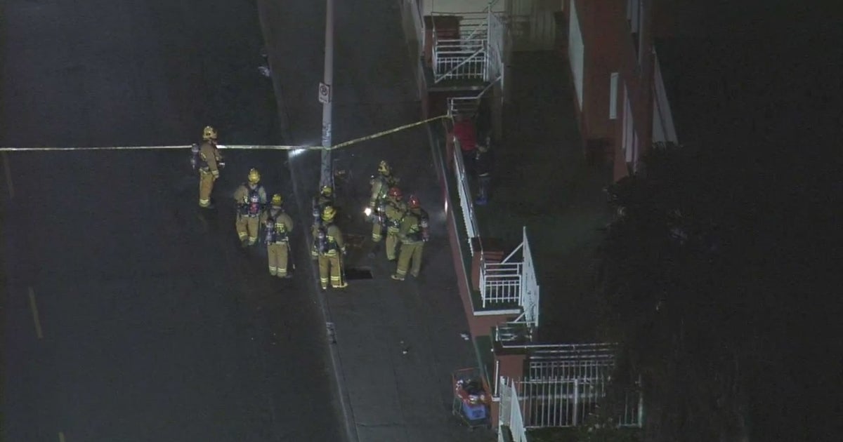 WATCH Small Flames Along Sidewalk After Gas Leak Sparks Underground