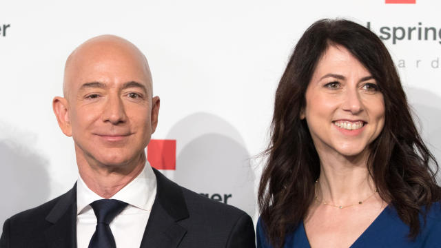 Amazon CEO Jeff Bezos and his wife MacKenzie Bezos pose as they arrive at the headquarters of publisher Axel-Springer on April 24, 2018, in Berlin. 