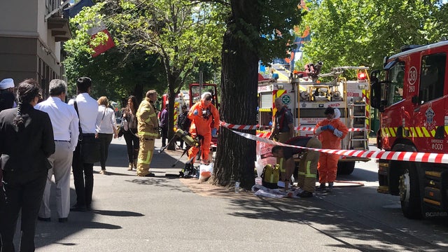 Hazmat and fire crews are seen outside the Indian and French Consulates on St Kilda Road in Melbourne 