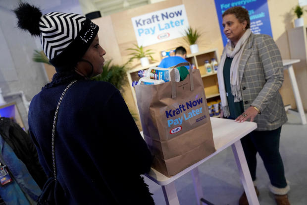 Federal workers left unpaid or furloughed collect a free bag of groceries from Kraft Foods on the 27th day of the partial government shutdown in Washington 