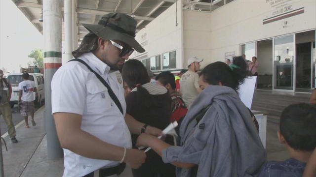 ctm-0121-mexico-migrant-processing-caravan-wrist-bands.jpg 