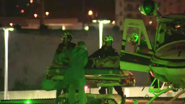 Crews transport a patient from a helicopter at Jackson Memorial Hospital's Ryder Trauma Center in Miami on Feb. 12, 2019. 